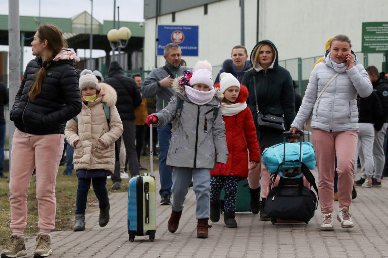 People cross the border between Poland and Ukraine